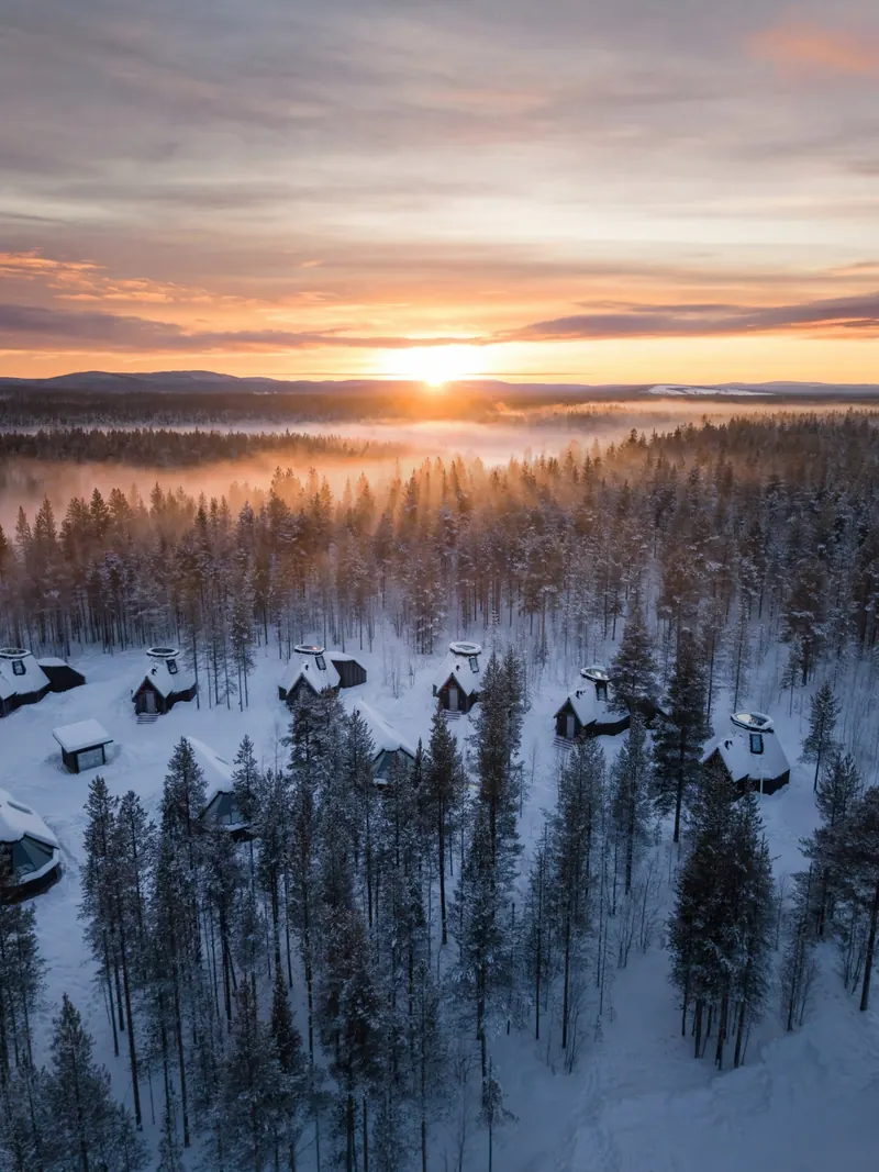 The cabins in the forest from above at sunrise
